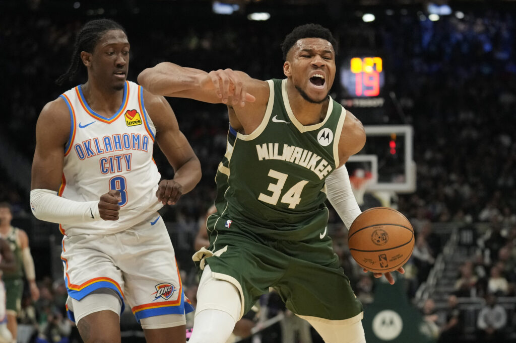 NBA: Giannis Antetokounmpo #34 of the Milwaukee Bucks reacts after being fouled by Jalen Williams #8 of the Oklahoma City Thunder during the second half at Fiserv Forum on March 24, 2024 in Milwaukee, Wisconsin. | Getty Images via AFP