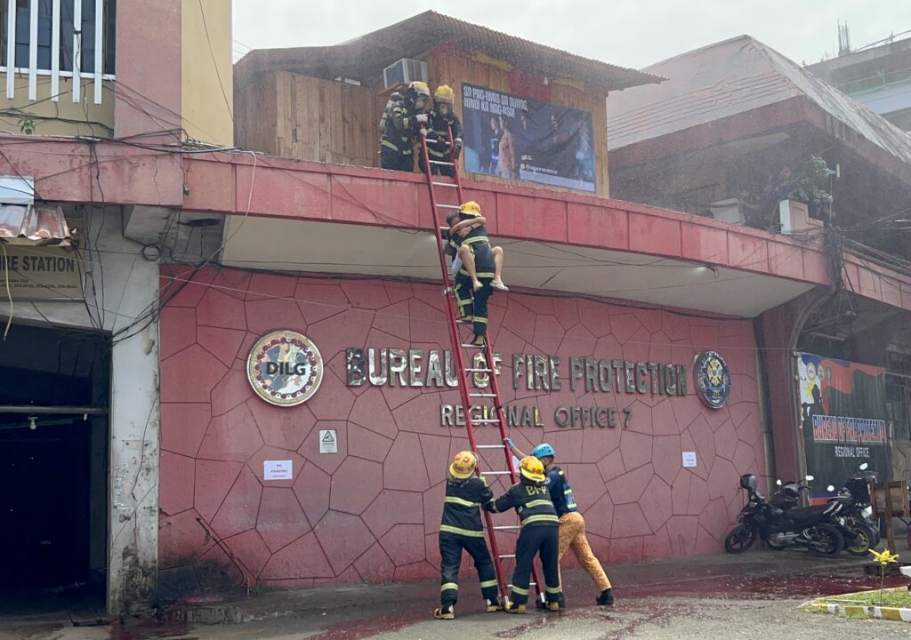 Members of the Talamban Fire Substation demonstrated a simulation of a fire rescue during the kick-off ceremony for Fire Prevention Month 2024. | Photo by Emmariel Ares