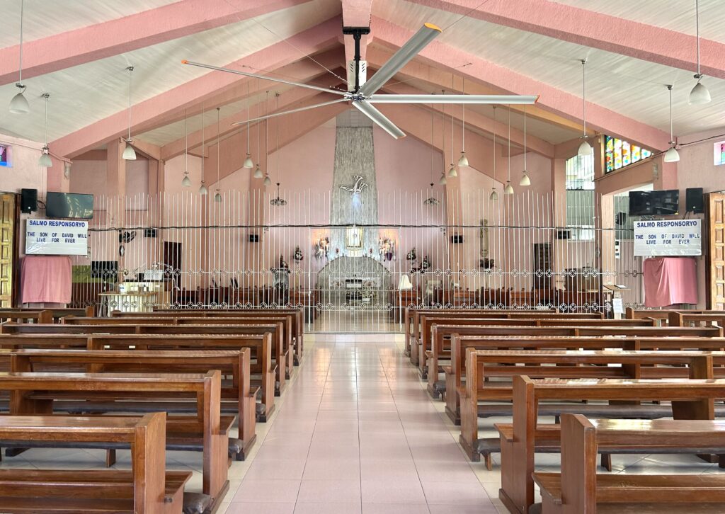 Visita Iglesia 2024: Pink Sisters Chapel -- Adoration Convent of Divine Peace Chapel Holy Week 2024. Railings separate the area for the Pink Sisters - the nuns in the convent from their area of prayer at the chapel. 