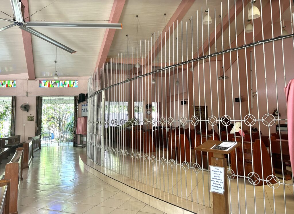 Railings separating the prayer area of the Pink Sisters at the Adoration Convent of Divine Peace Chapel. | Emmariel Ares