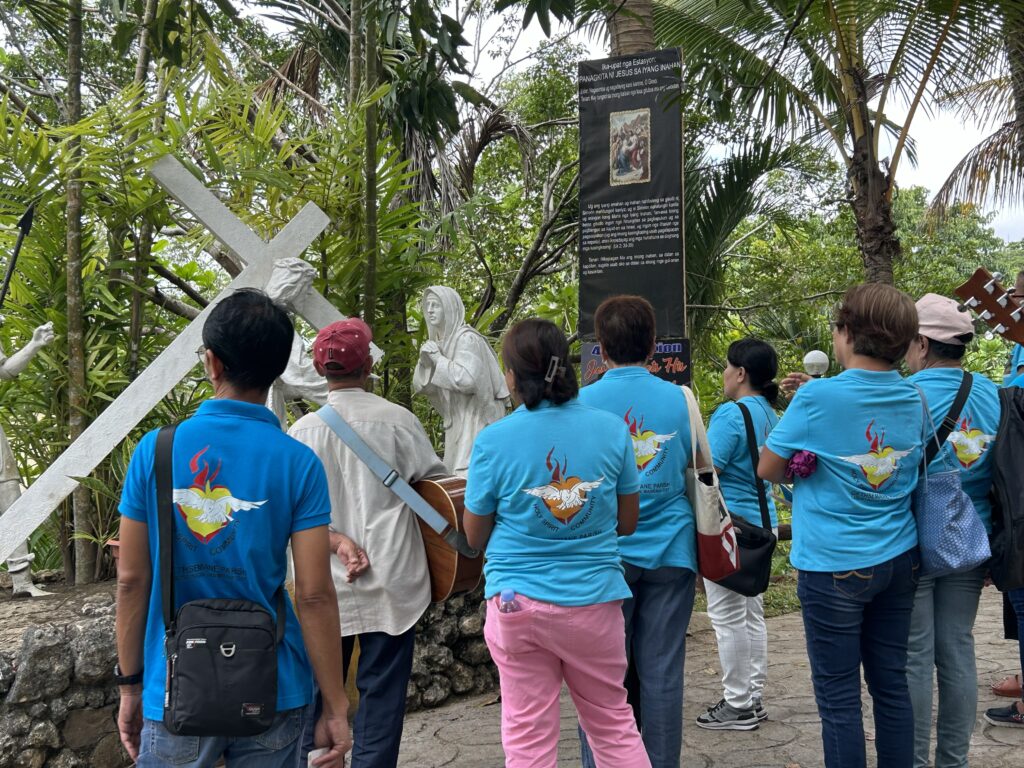 A group of devotees reflect on the Passion of Christ through the Stations of the Cross in Tabor Hill.