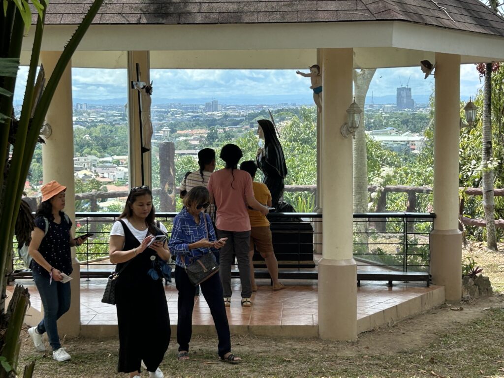 Devotees do the Stations of the Cross in Tabor Hill.
