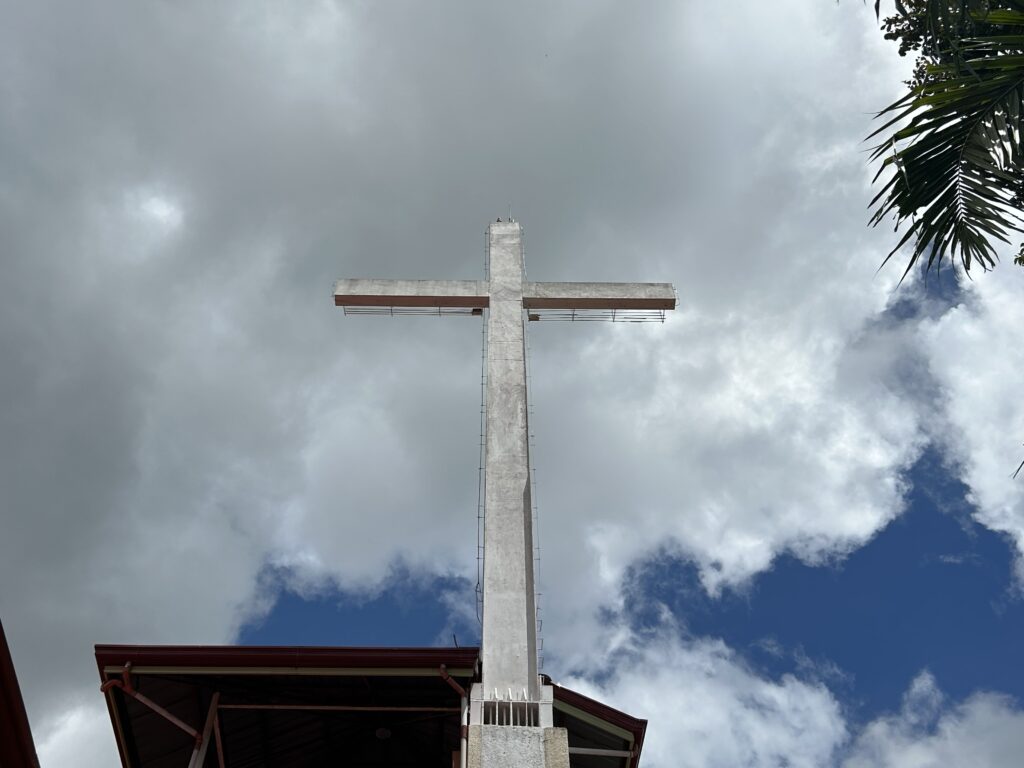 A cross stands tall in Tabor Hill.