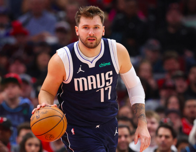 NBA: Doncic : Luka Doncic #77 of the Dallas Mavericks dribbles up the court against the Chicago Bulls during the first half at the United Center on March 11, 2024 in Chicago, Illinois. | Getty Images via AFP
