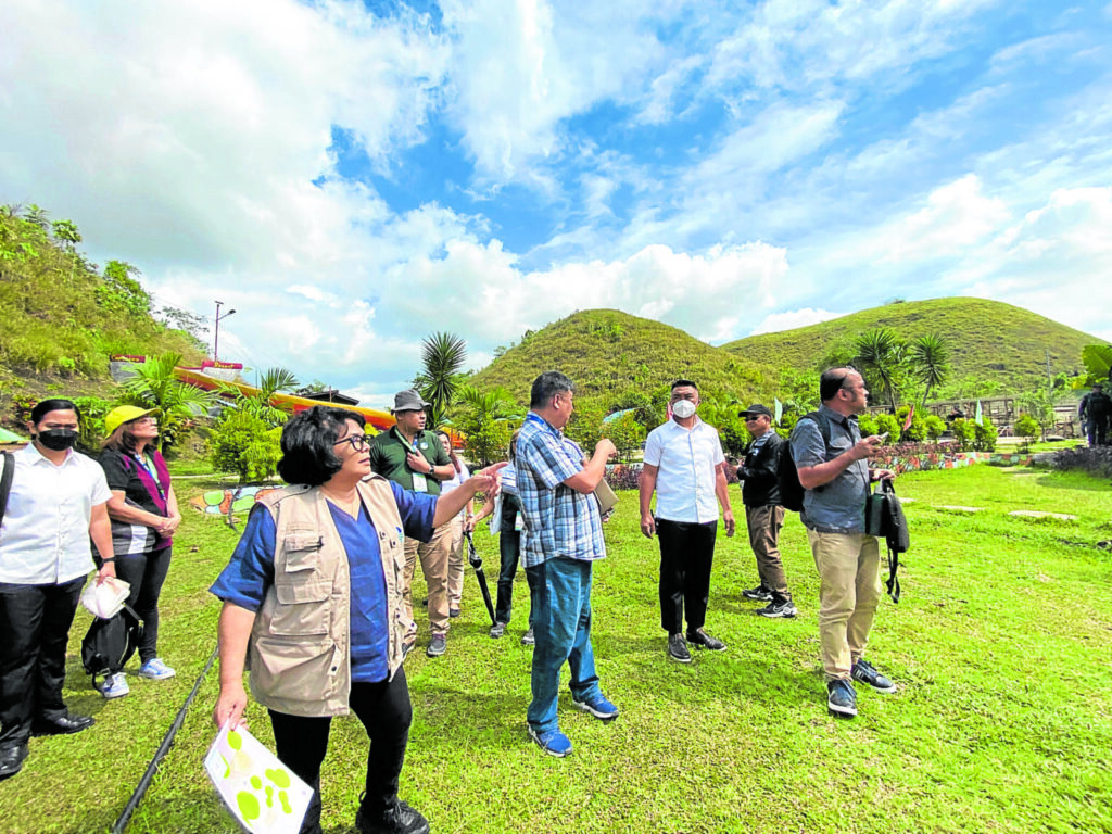 Environment Secretary Maria Antonia Yulo Loyzaga (third from left) leads a government team inspecting the Captain’s Peak Garden and Resort in Sagbayan, Bohol, on Thursday. The visit was part of the Department of Environment and Natural Resources’ investigation into the illegal structures within the Chocolate Hills.