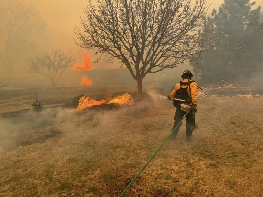 US wildfires: They’re getting bigger, prompting changes in firefighting workforce. Photo is a handout picture courtesy of the Flower Mound Fire Department taken on February 28, 2024, shows a firefighter battling the Smokehouse Creek Fire, near Amarillo, in the Texas Panhandle.
