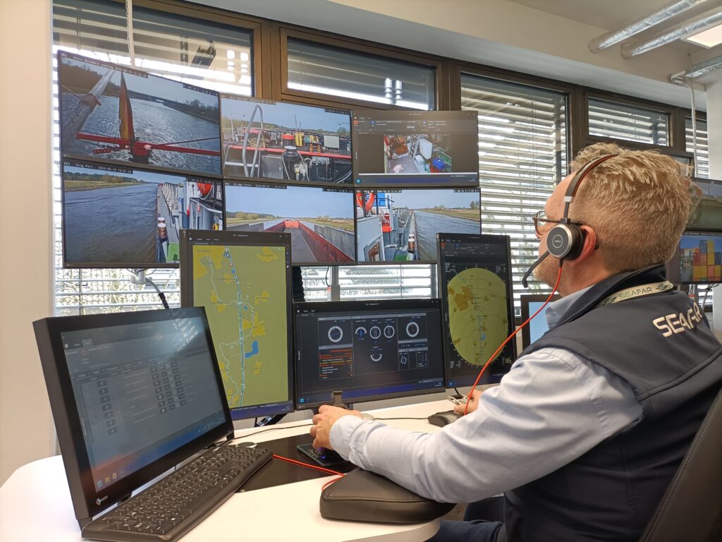 Remote-controlled ships eyed by German group to fix skipper shortage. Picture taken on March 19, 2024 in Duisburg, western Germany, shows Patrick Hertoge, ship navigator for Belgian startup Seafar, sitting behind screens and handling remote-controlled navigation on rivers in Germany. | AFP