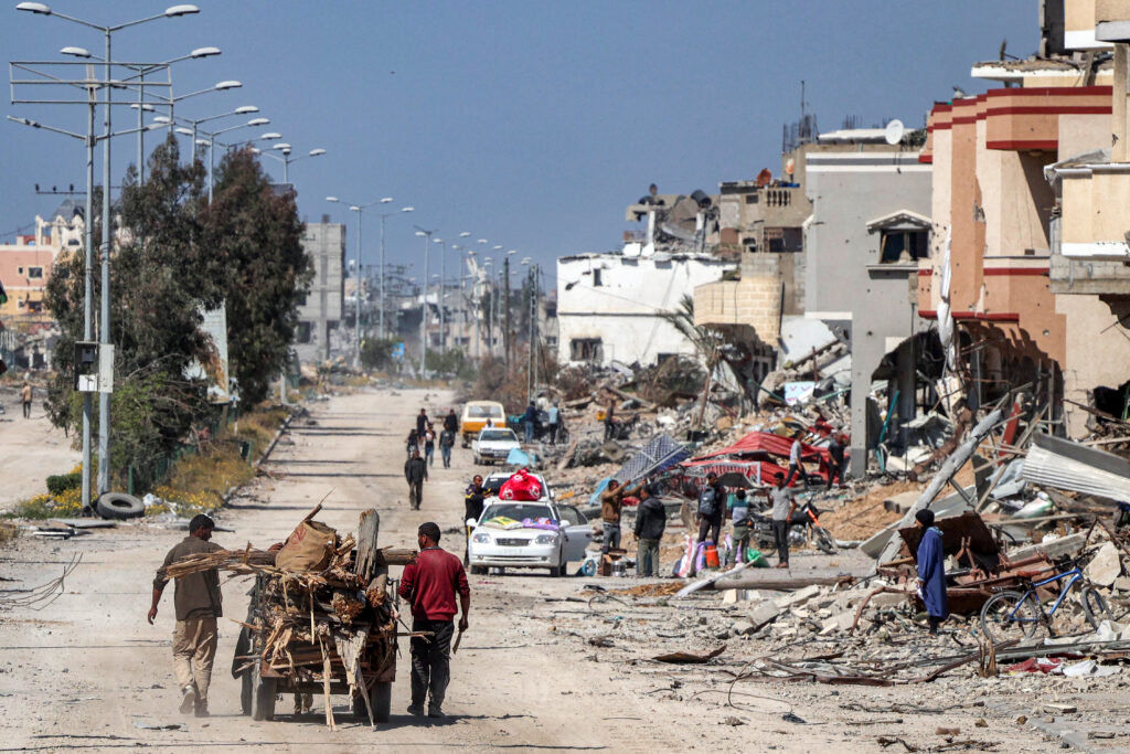 Israel says readying for Rafah. In photo are Men walk with an animal-drawn cart carrying salvaged wood from debris and trees past destroyed buildings in Khan Yunis on April 7, 2024 after Israel pulled its ground forces out of the southern Gaza Strip, six months into the devastating war sparked by the October 7 attacks. Israel pulled all its troops out of southern Gaza on April 7, including from the city of Khan Yunis, the military and Israeli media said, after months of fierce fighting with Hamas militants left the area devastated. (Photo by AFP)