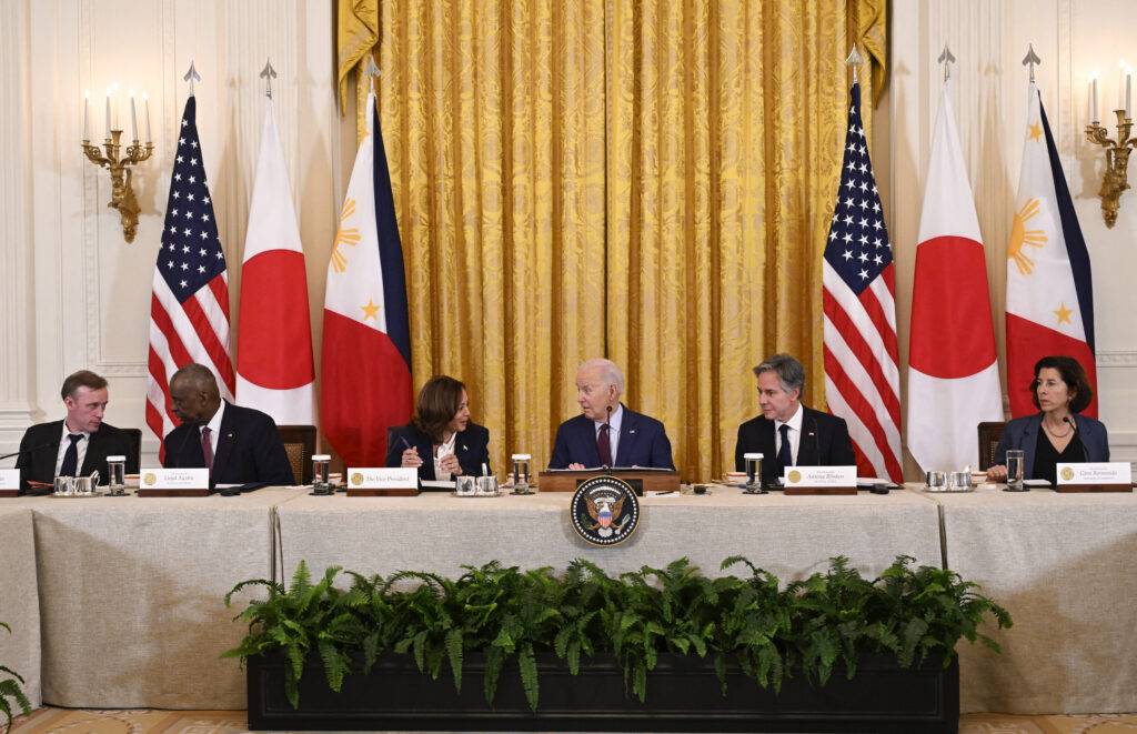 National Security Advisor Jake Sullivan (from left), Secretary of Defense Lloyd Austin, US Vice President Kamala Harris, US President Joe Biden, Secretary of State Antony Blinken and Secretary of Commerce Secretary of Commerce Gina Raimondo participate in a trilateral meeting with Japanese Prime Minister Fumio Kishida and Filipino President Ferdinand Marcos Jr. in the East Room of the White House in Washington, DC, on April 11, 2024. (Photo by ANDREW CABALLERO-REYNOLDS / AFP)