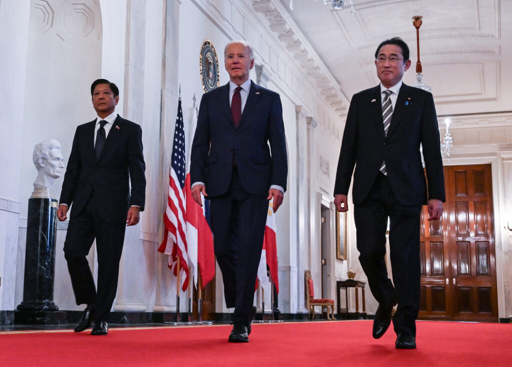 Biden vows 'ironclad' defense of Philippines, Japan as China tension mounts. In photo is US President Joe Biden heading to a trilateral meeting with Japanese Prime Minister Fumio Kishida (R) and Filipino President Ferdinand Marcos Jr. (L) at the White House in Washington, DC, on April 11, 2024. | AFP