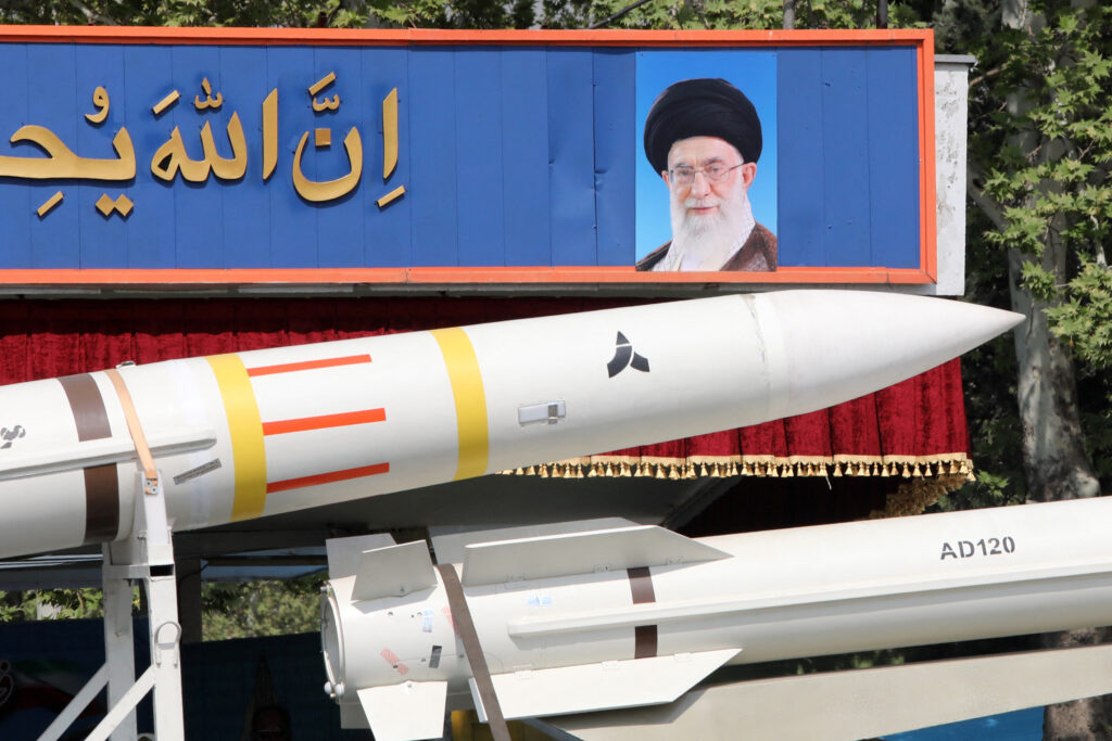 Israel launches strike against Iran: US media. In photo is an Iranian military truck carrying parts of a Sayad 4-B missile past a portrait of supreme leader Ayatollah Ali Khamenei during a military parade as part of a ceremony marking the country's annual army day in Tehran on April 17, 2024. (Photo by ATTA KENARE / AFP)