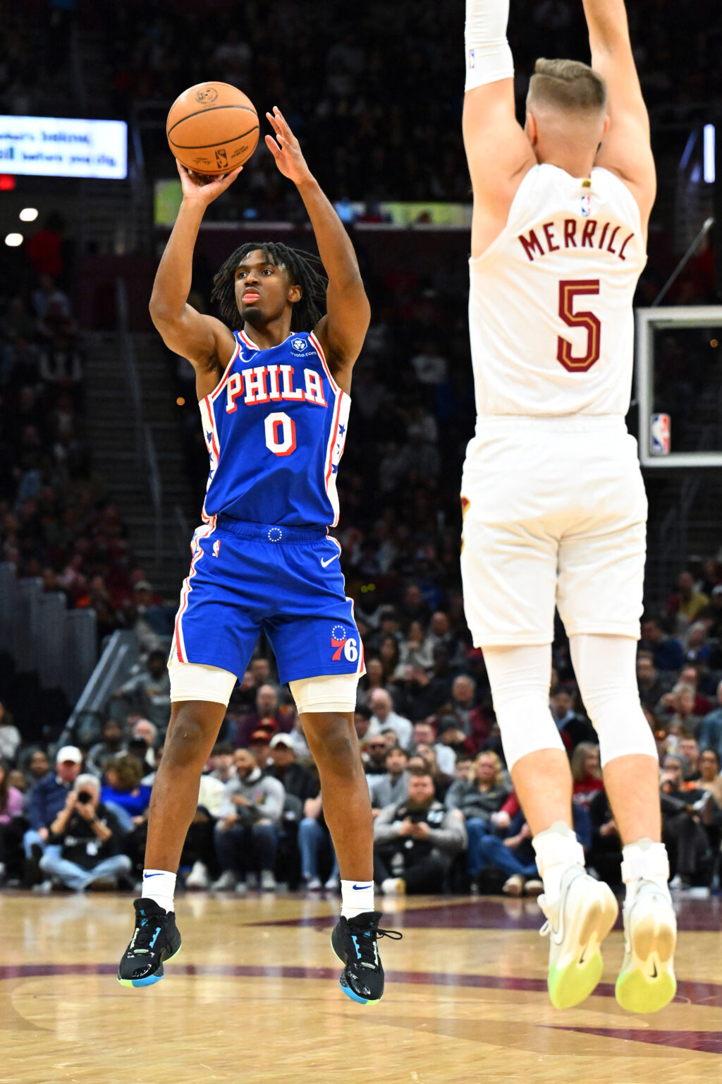 Tyrese Maxey #0 leads the Philadelphia 76ers to a win against Miami Heat in their game on April 4. Photo shows Maxey shooting over Sam Merrill #5 of the Cleveland Cavaliers during the first half at Rocket Mortgage Fieldhouse on March 29, 2024 in Cleveland, Ohio. | AFP