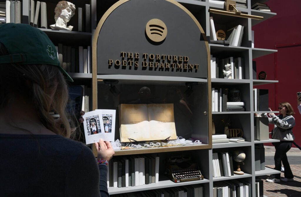 Taylor Swift: Is her 'The Tortured Poets Department' poetry? In photo are Attendees taking pictures at Spotify's Taylor Swift pop-up at The Grove for her new album "The Tortured Poets Department" at The Grove on April 16, 2024 in Los Angeles, California. | Getty Images via AFP