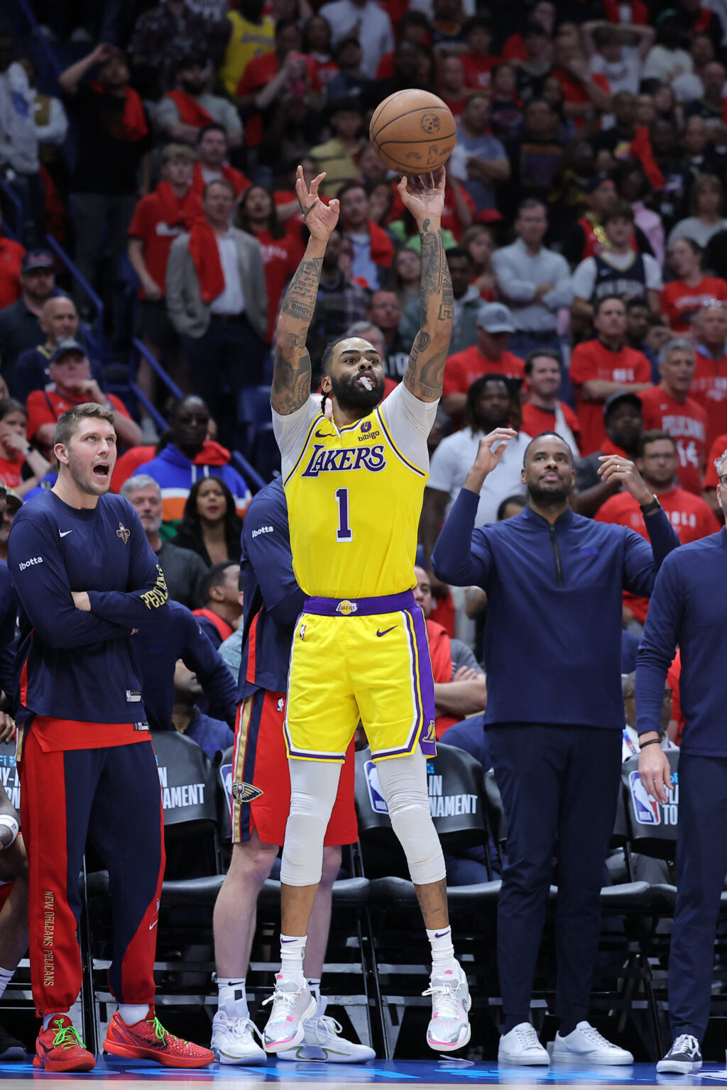 NBA: Lakers book playoff date with Nuggets, Kings eliminate Warriors. D'Angelo Russell #1 of the Los Angeles Lakers shoots during the second half of a play-in tournament game against the New Orleans Pelicans at the Smoothie King Center on April 16, 2024 in New Orleans, Louisiana. | Getty Images via AFP