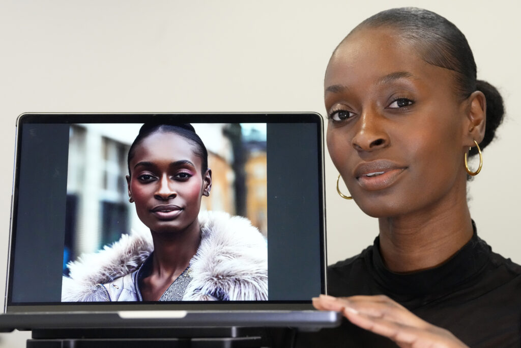 AI-generated models could bring more diversity to fashion industry. Fashion model Alexsandrah poses with a computer showing an AI generated image of her, in London, Friday, March 29, 2024. | AP