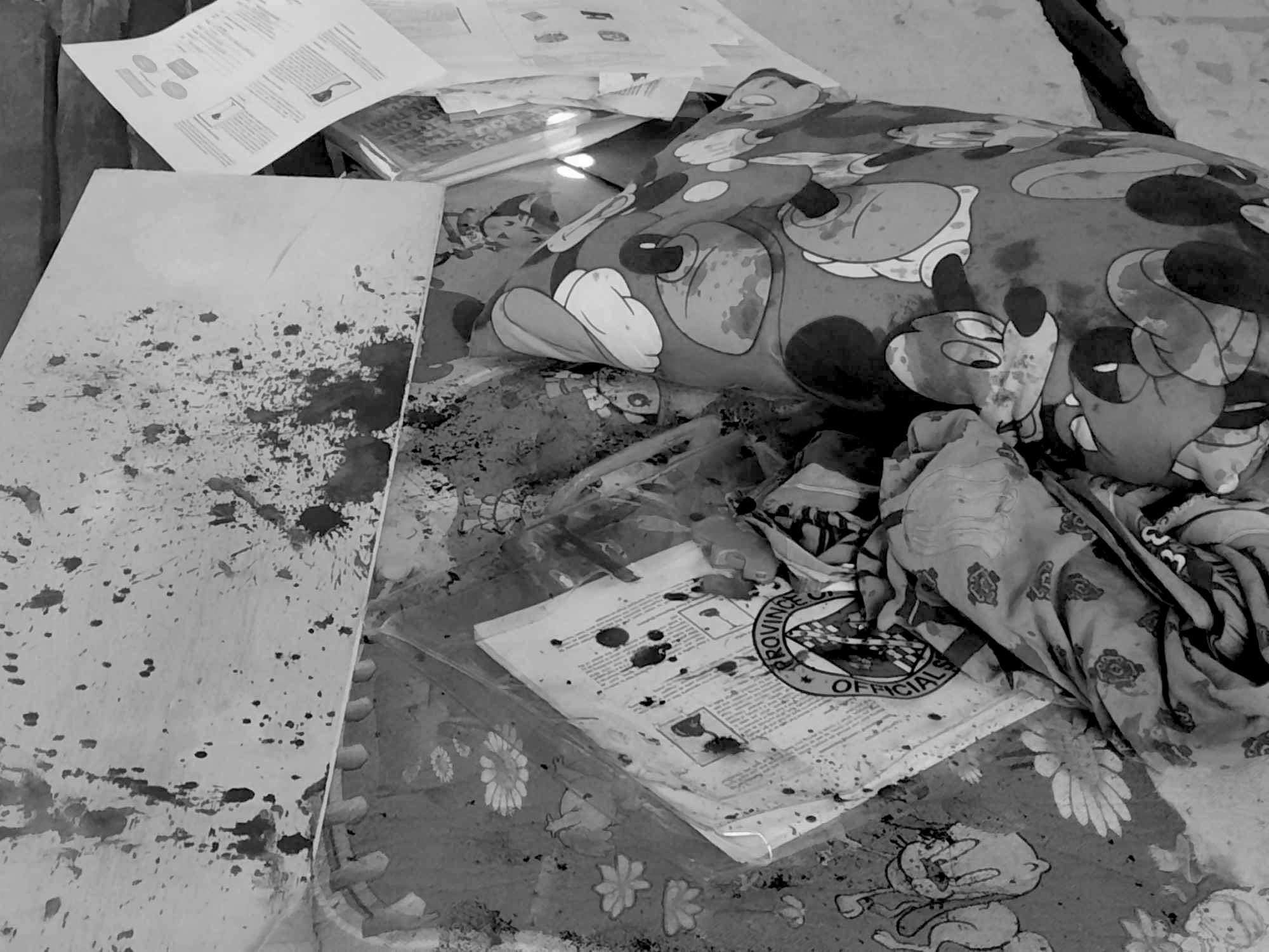 Girl killed in Talisay: Was it a case of accidental shooting? In photo are policemen investigating the shooting where a 14-year-old girl answeing her modules inside her house was killed on April 26. | Paul Lauro