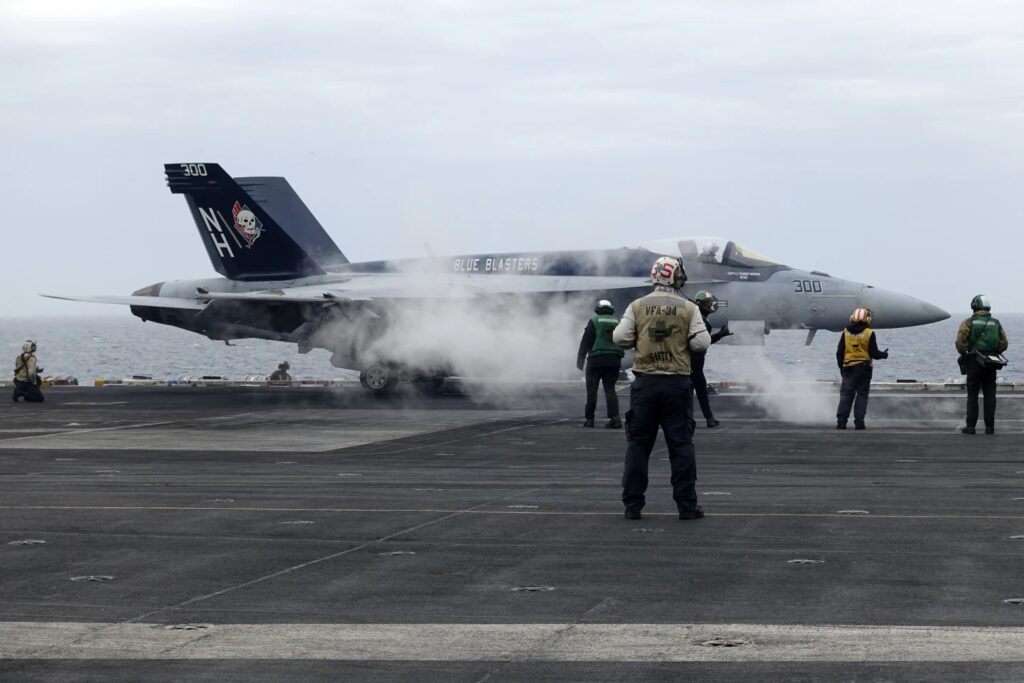 A F-18E fighter jet prepares to take off from USSTheodore Roosevelt aircraft carrier on Thursday April 11, 2024, during a three-day joint naval exercise by the U.S., Japanese and South Korea at the East China Sea amid tension from China and North Korea.