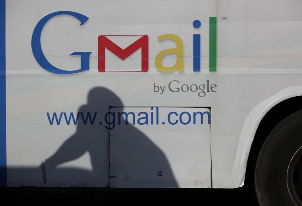 An ad for Google's Gmail appears on theside of a bus. 