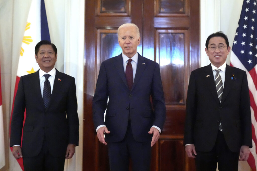 President Joe Biden, center, Philippine President Ferdinand Marcos Jr., left, and Japanese Prime Minister Fumio Kishida pose before a trilateral meeting in the East Room of the White House in Washington, Thursday, April 11, 2024.