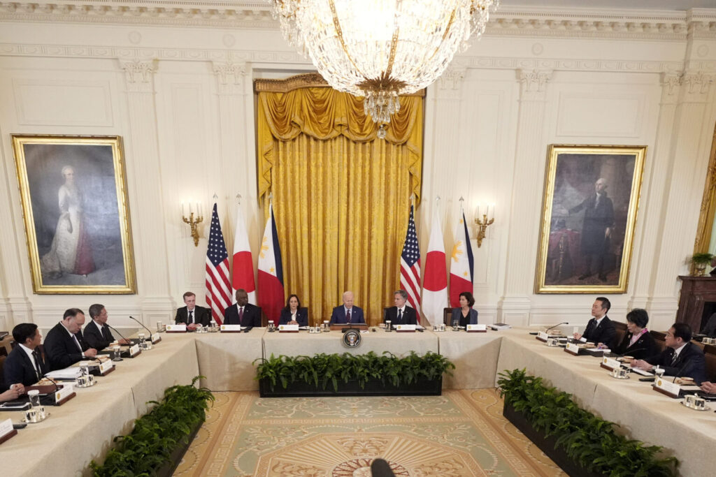 President Joe Biden, center, Philippine President Ferdinand Marcos Jr., left, and Japanese Prime Minister Fumio Kishida, right, attend a trilateral meeting in the East Room of the White House in Washington, Thursday, April 11, 2024.