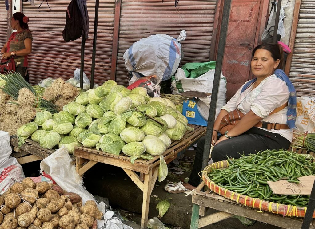 Vegetable vendor at Carbon Market