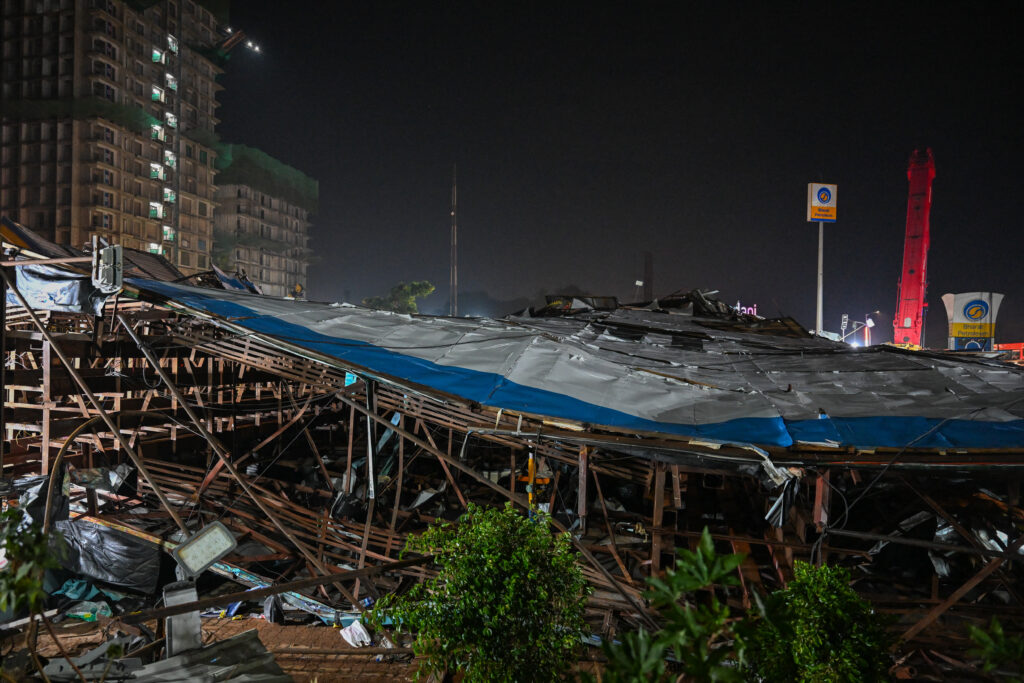 India billboard collapse: 12 dead, 60 injured. This photograph shows the site where an advertisement billboard collapsed at a petrol station following a dust storm in Mumbai on May 13, 2024. (Photo by Punit PARANJPE / AFP)