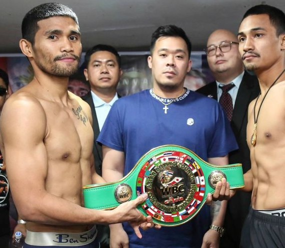 Marlon Tapales (left) and Nattapong Jankaew (right) hold the WBC regional title belt during the weigh-in. In the middle is Sanman Boxing's top honcho JC Manangquil.