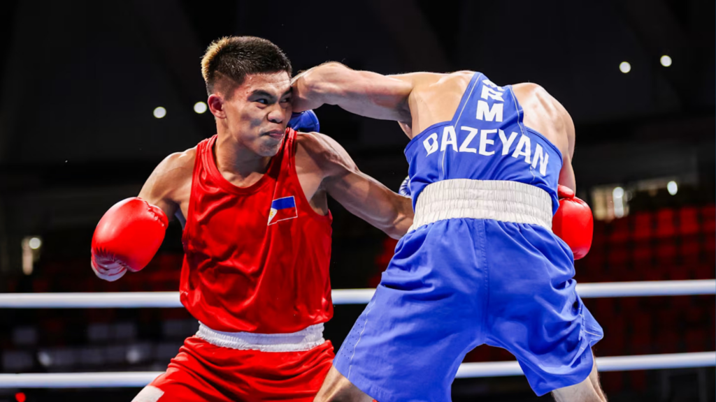 Carlo Paalam (in red) during his bout against Armenia's Artur Bazeyan (blue) in the 2024 Boxing 2nd World Qualification Tournament. | Photo from the Olympics' official website
