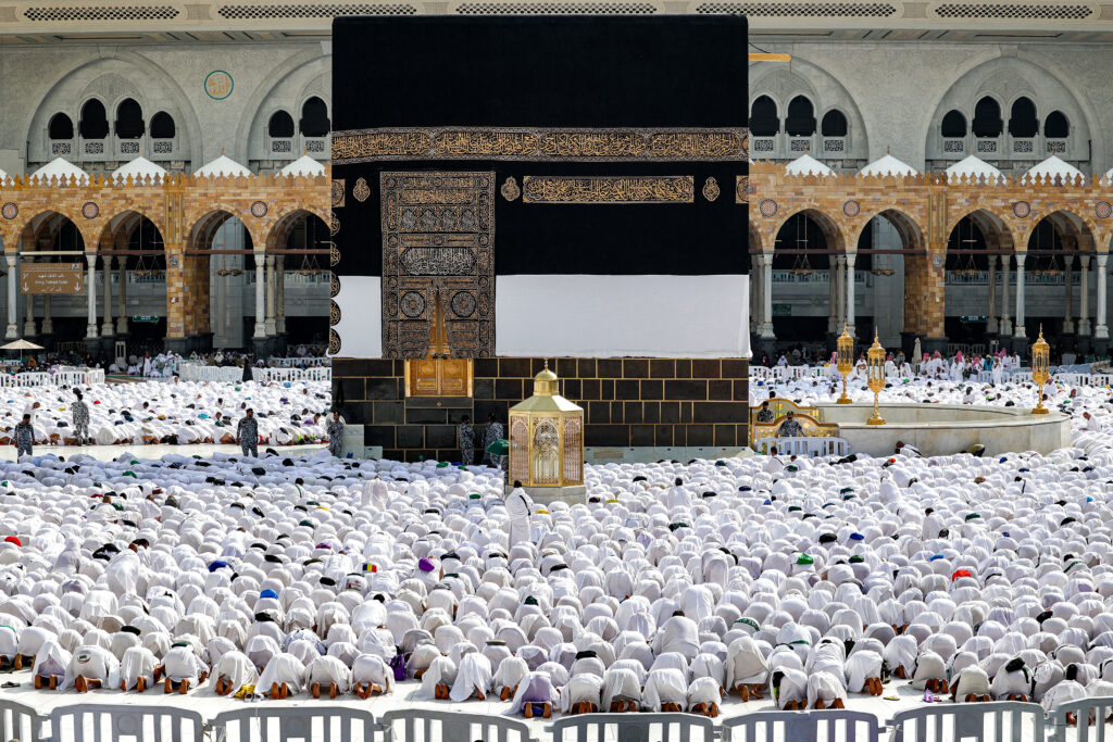 Muslim worshippers pray around the Kaaba, Islam's holiest shrine, at the Grand Mosque in Saudi Arabia's holy city of Mecca on June 4, 2024 as pilgrims arrive ahead of the annual hajj pilgrimage. / AFP