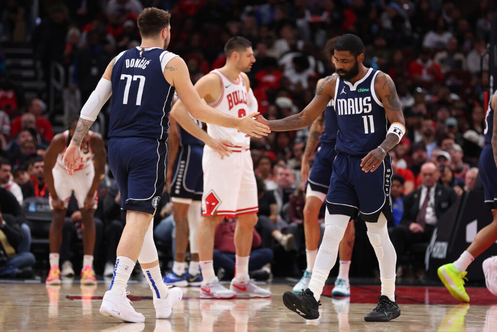NBA: Doncic and Irving lead Mavs against Celtics for crown. Luka Doncic #77 of the Dallas Mavericks high fives Kyrie Irving #11 against the Chicago Bulls during the first half at the United Center on March 11, 2024 in Chicago, Illinois. [FILE] Getty Images via AFP