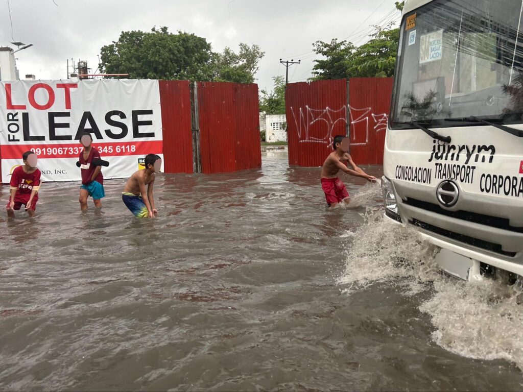 Tipolo kids playing in flood in Mandaue