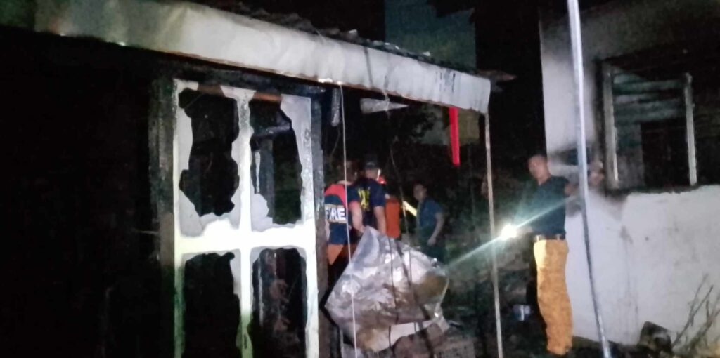 LOOK: Talamban fire kills 10-year-old boy. Photo shows firefighters do overhauling at the fire scene. | Paul Lauro