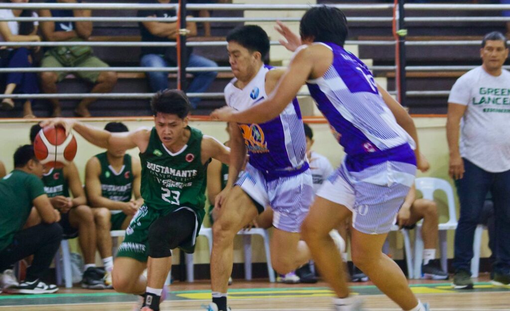UV's Raul Gentallan is seen being heavily defended by Adamson Soaring Falcons' players.