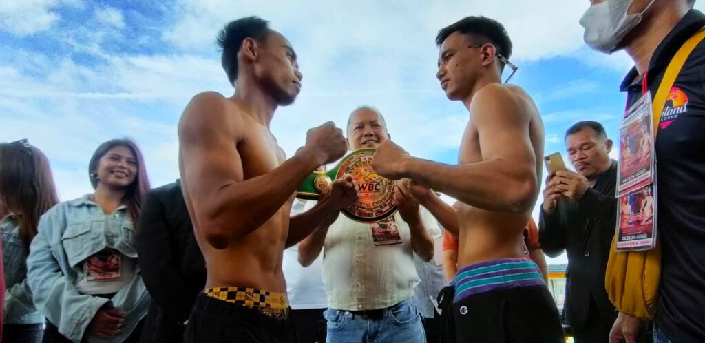 Santisima, Thai foe ready for ‘Bakbakan sa Masbate 2’ mainer. Jeo Santisima (left) and Arnon Yupang (right) stare at each other during the weigh-in for their WBC regional title bout in the main event of "Bakbakan sa Masbate 2”. | Contributed photo.