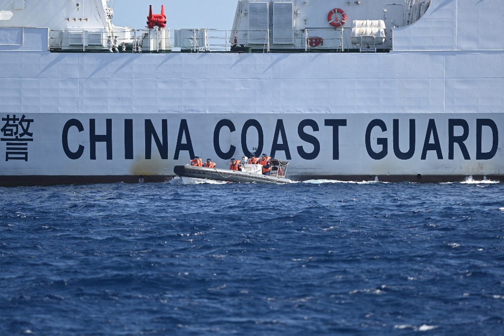 Chinese Guard Guard: PH to blame for latest ship collision at WPSThis photo taken on February 16, 2024, shows a rigid hull inflatable boat leaving a Chinese coast guard vessel near the China-controlled Scarborough Shoal, in disputed waters of the South China Sea. | FILE PHOTO/AFP
