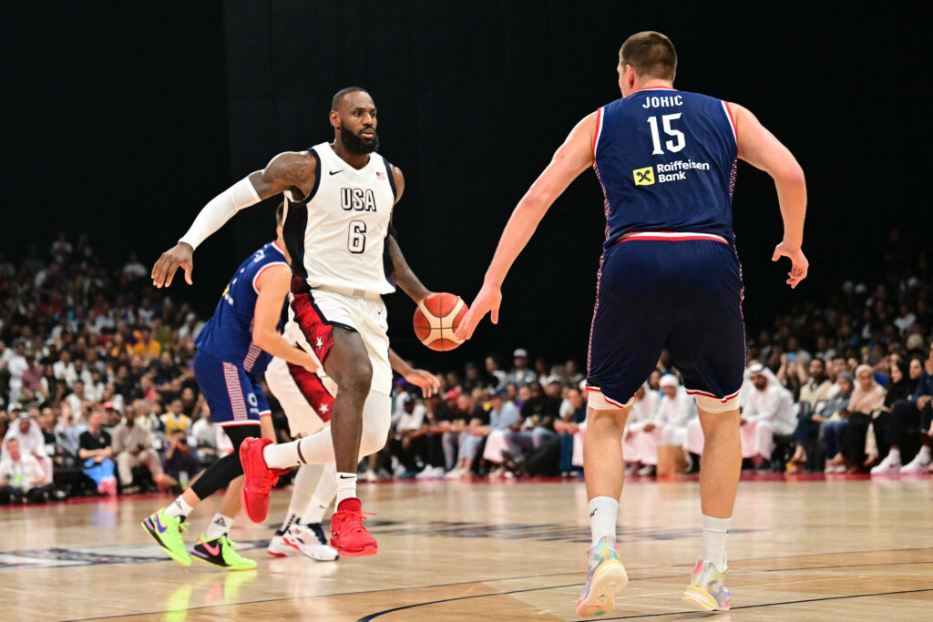 Lebron on Team USA:  ‘Much to improve’ before Olympics. US forward #06 LeBron James fights for the ball against Serbia's centre #15 Nikola Jokic during the Basketball Showcase friendly match between the United States and Serbia the at Etihad Arena in Abu Dhabi on July 17, 2024. | AFP