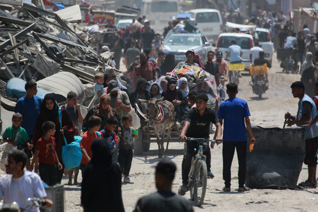 Gaza war: Palestinians flee as Israel sets sights on safe zone.Palestinian civilians move away from the eastern districts of Khan Yunis in the southern Gaza Strip following evacuation orders by the Israeli army on July 22, 2024, amid the ongoing conflict between Israel and the Palestinian Hamas militant group. The nine-month-old war in the Palestinian territory raged on unabated on July 22, with Israel telling civilians in the eastern part of Khan Yunis to evacuate. (Photo by Bashar TALEB / AFP)