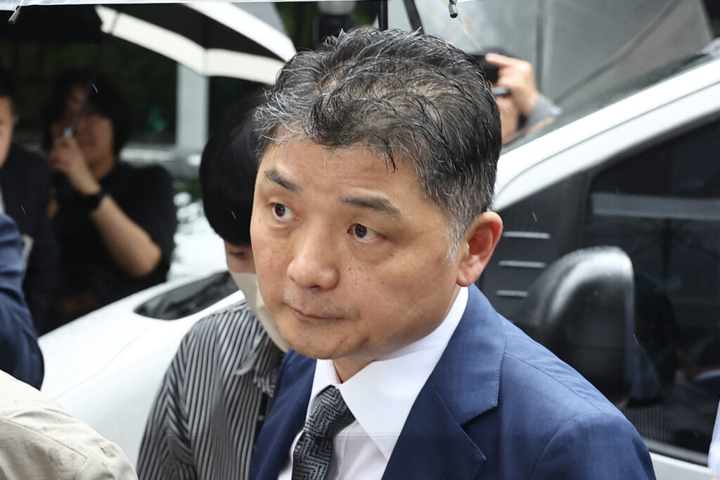 Kim Beom-su, founder of South Korean internet company Kakao, arrives at a court in Seoul on July 22, 2024. The billionaire founder of South Korean internet conglomerate Kakao was arrested early on July 23, a Seoul court said, accused of manipulating stock prices during the acquisition of K-pop powerhouse SM Entertainment. The Seoul Southern District Court approved an arrest warrant for Kakao founder Kim Beom-su, citing risks of him fleeing and destroying evidence, it said in a statement.| AFP