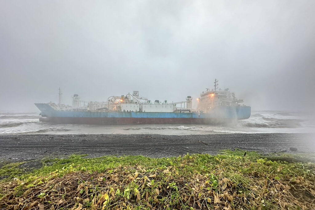 This handout picture taken and released on July 25, 2024 by the Taiwan Coast Guard shows the Indonesia-flagged cargo ship Iriana stranded near the coast in Pingtung County during Typhoon Gaemi. The typhoon -- the strongest to hit Taiwan in eight years -- had already forced authorities on the island to close schools and offices, suspend the stock market and evacuate thousands of people. (Photo by Handout / TAIWAN COAST GUARD / AFP) / RESTRICTED TO EDITORIAL USE - MANDATORY CREDIT "AFP PHOTO / Taiwan Coast Guard" - NO MARKETING NO ADVERTISING CAMPAIGNS - DISTRIBUTED AS A SERVICE TO CLIENTS