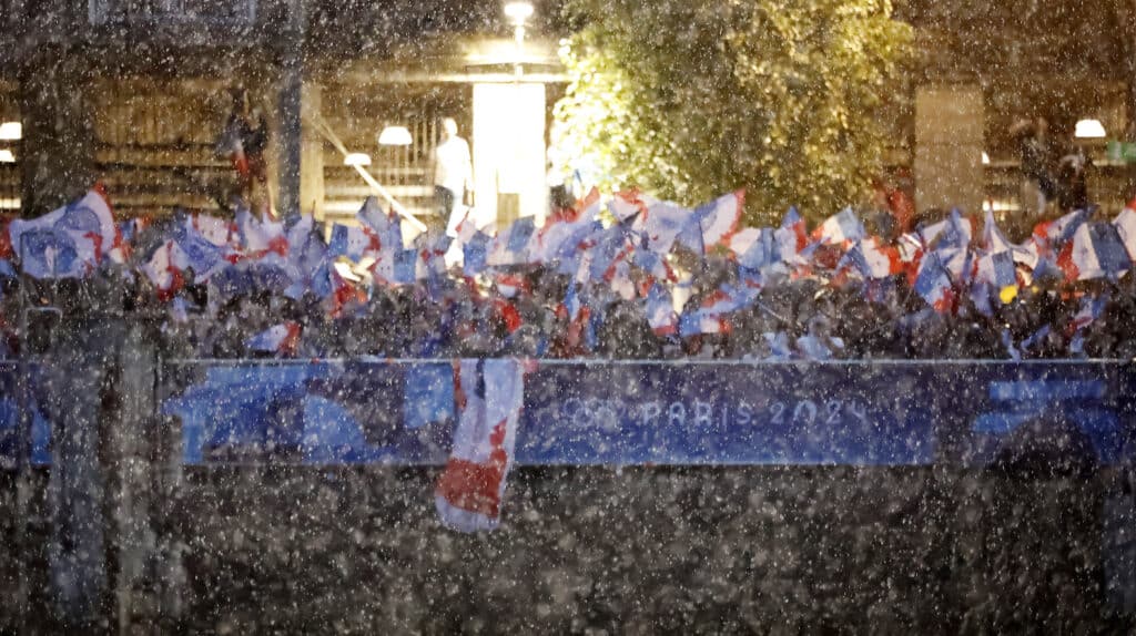 Paris 2024 Olympics - Opening Ceremony - Paris, France - July 26, 2024. General view of rain as the floating parade travels along the river Seine during the opening ceremony. (Photo by Clodagh Kilcoyne / POOL / AFP)