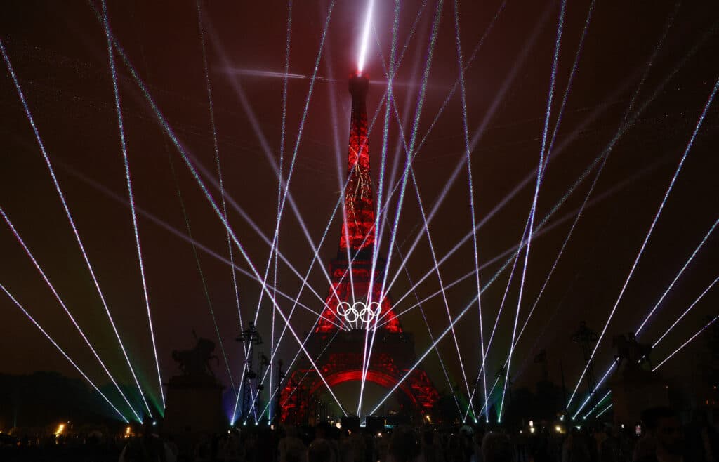 Paris Olympics: Police probe abuse targeting DJ over ‘Last Supper’. Paris 2024 Olympics - Opening Ceremony - Paris, France - July 26, 2024. General view of a light show on the Eiffel Tower during the opening ceremony. (Photo by Stephanie Lecocq / POOL / AFP)