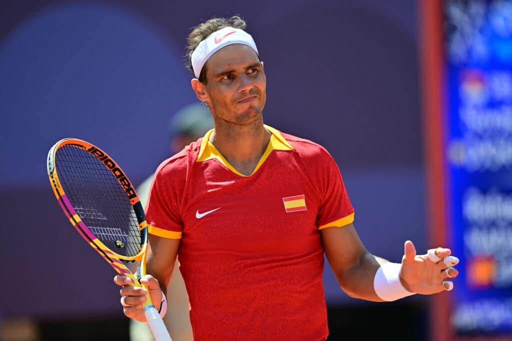 Spain's Rafael Nadal reacts while playing Serbia's Novak Djokovic during their men's singles second round tennis match on Court Philippe-Chatrier at the Roland-Garros Stadium in Paris Games. | AFP