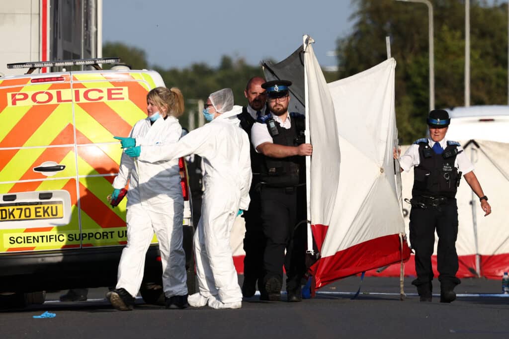 Police officers and forensic personnel put up a fence on Hart Street in Southport, northwest England, on July 29, 2024, following a knife attack, where two children have been killed and 11 more injured | Photo by Darren Staples / AFP