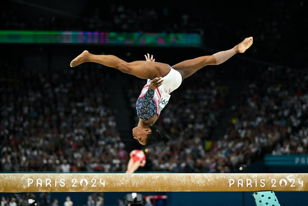 US' Simone Biles competes in the balance beam event of the artistic gymnastics women's team final.