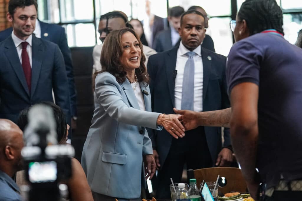 Harris taps rapper as she targets battleground Georgia. US Vice President and 2024 Democratic presidential candidate Kamala Harris greets people during a campaign stop at Paschal's, a historic Black-owned restaurant, in Atlanta, Georgia, on July 30, 2024. (Photo by Elijah Nouvelage / POOL / AFP)