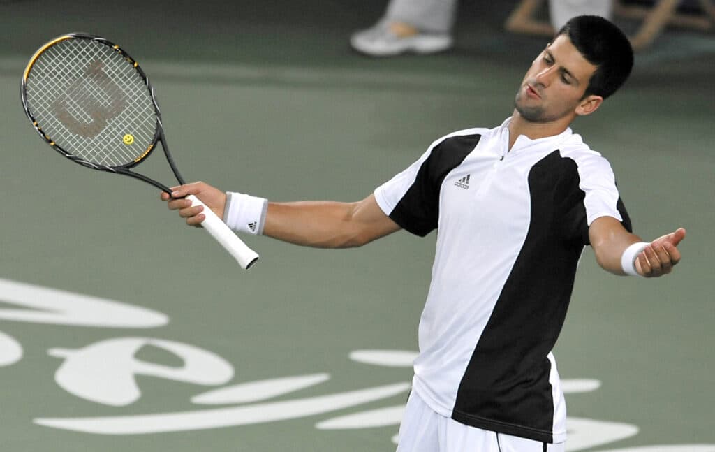 Olympics tennis blockbuster: Nadal says Djokovic 'clear favorite'. [FILE PHOTO] Novak Djokovic from Serbia gestures as he plays against Rafael Nadal of Spain during a men's singles semi-final tennis match at the Olympic Green Tennis Centre in Beijing on August 15, 2008, during the 2008 Beijing Olympics. AFP PHOTO/PHILIPPE HUGUEN (Photo by PHILIPPE HUGUEN / AFP)