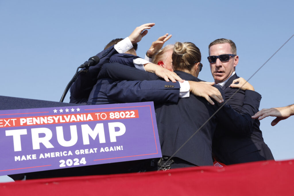 Trump shooting: Conflicting conspiracy theories emerge from it. In photo, former US President Donald Trump is rushed offstage after a lone gunman fired at him during a Republican rally in Butler, Pennsylvania on July 13, 2024. | AFP