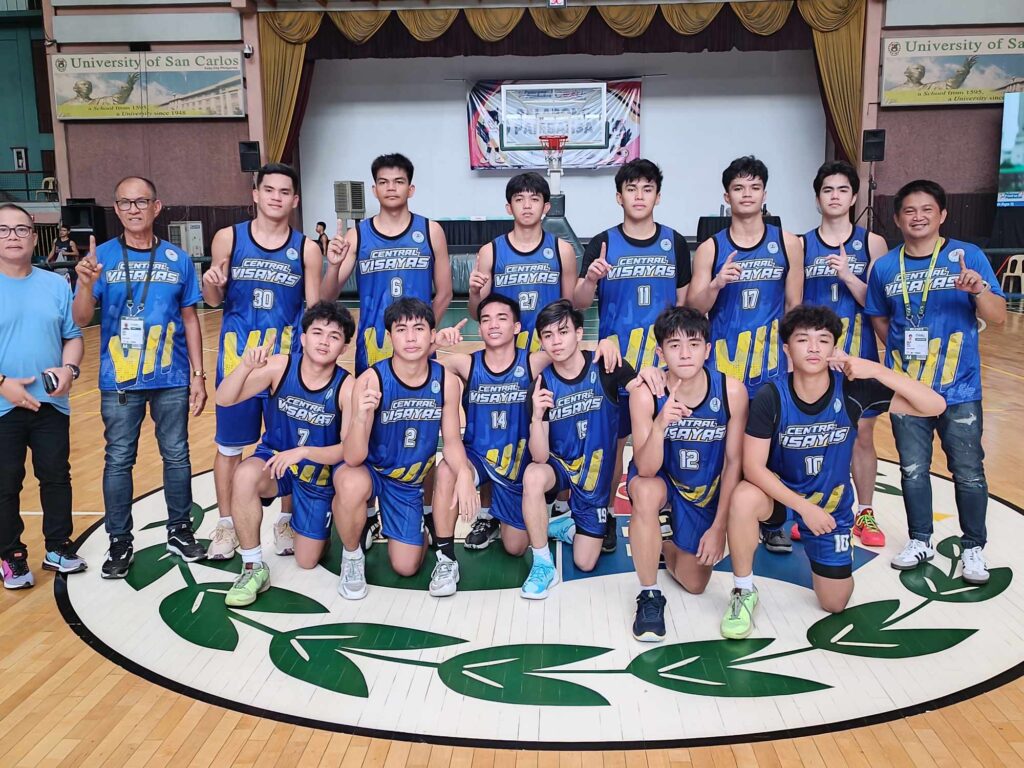 UV Baby Lancers players and coaching staff pose for a photo after winning their first game in Palarong Pambansa 2024.