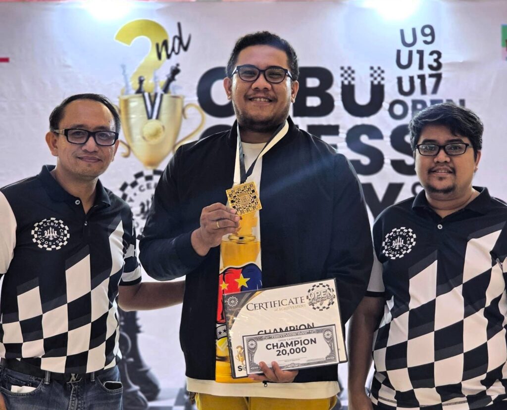 Chess: IM Pimentel rules CCS Cup's open division. IM Joel Pimentel (center) is flanked by Cebu Chess Society's Michael Joseph Pagaran (right) and Lawyer Gerald Serbise during the awarding. | Contributed photo