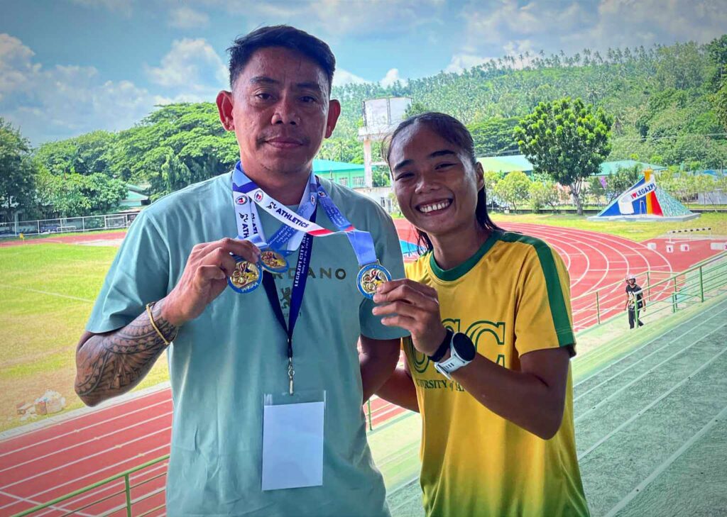 Artjoy Torregosa lets her coach, Arvin Loberanis proudly wear the three gold medals in the National PRISAA Games 2024. | Contributed photo